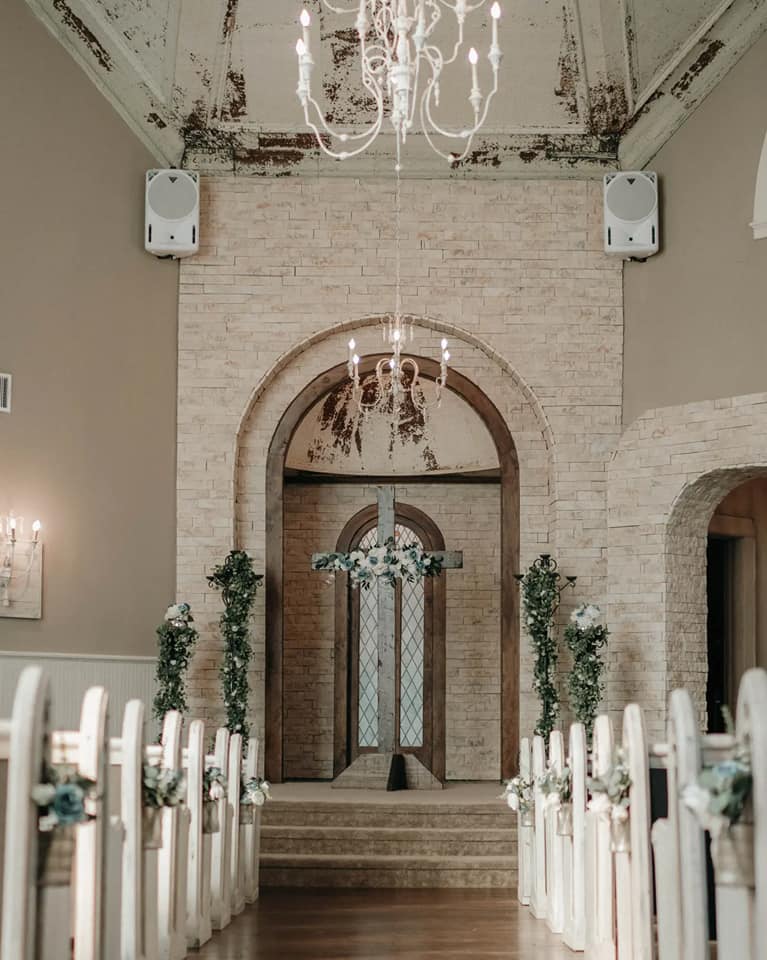 large wooden cross at church altar