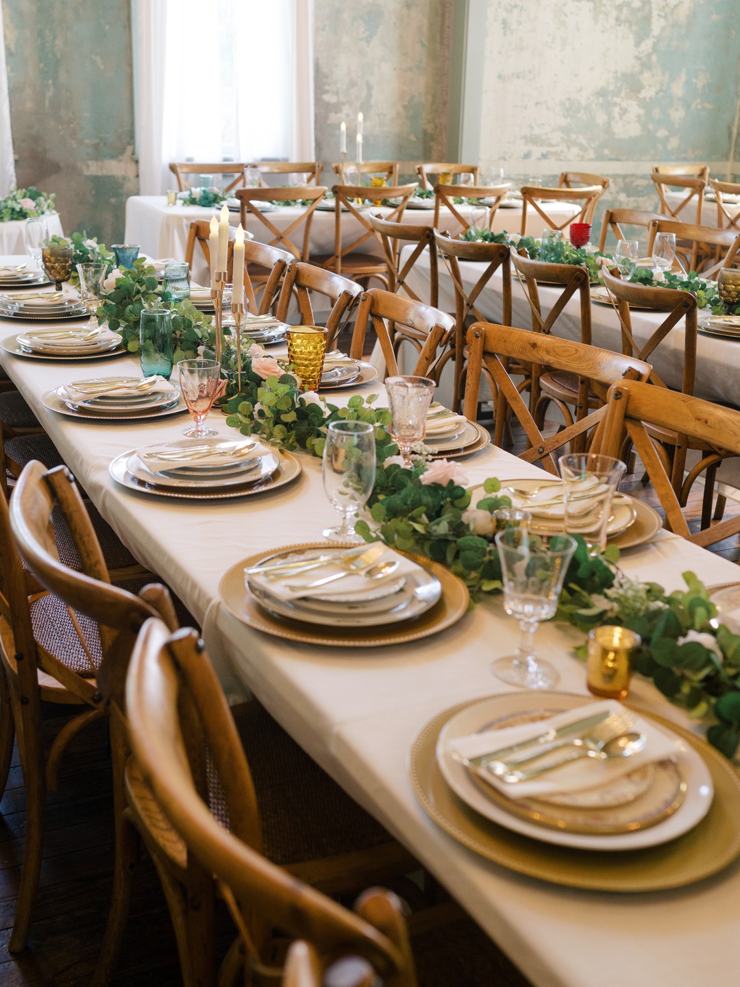 wooden tables with simple greenery table runner