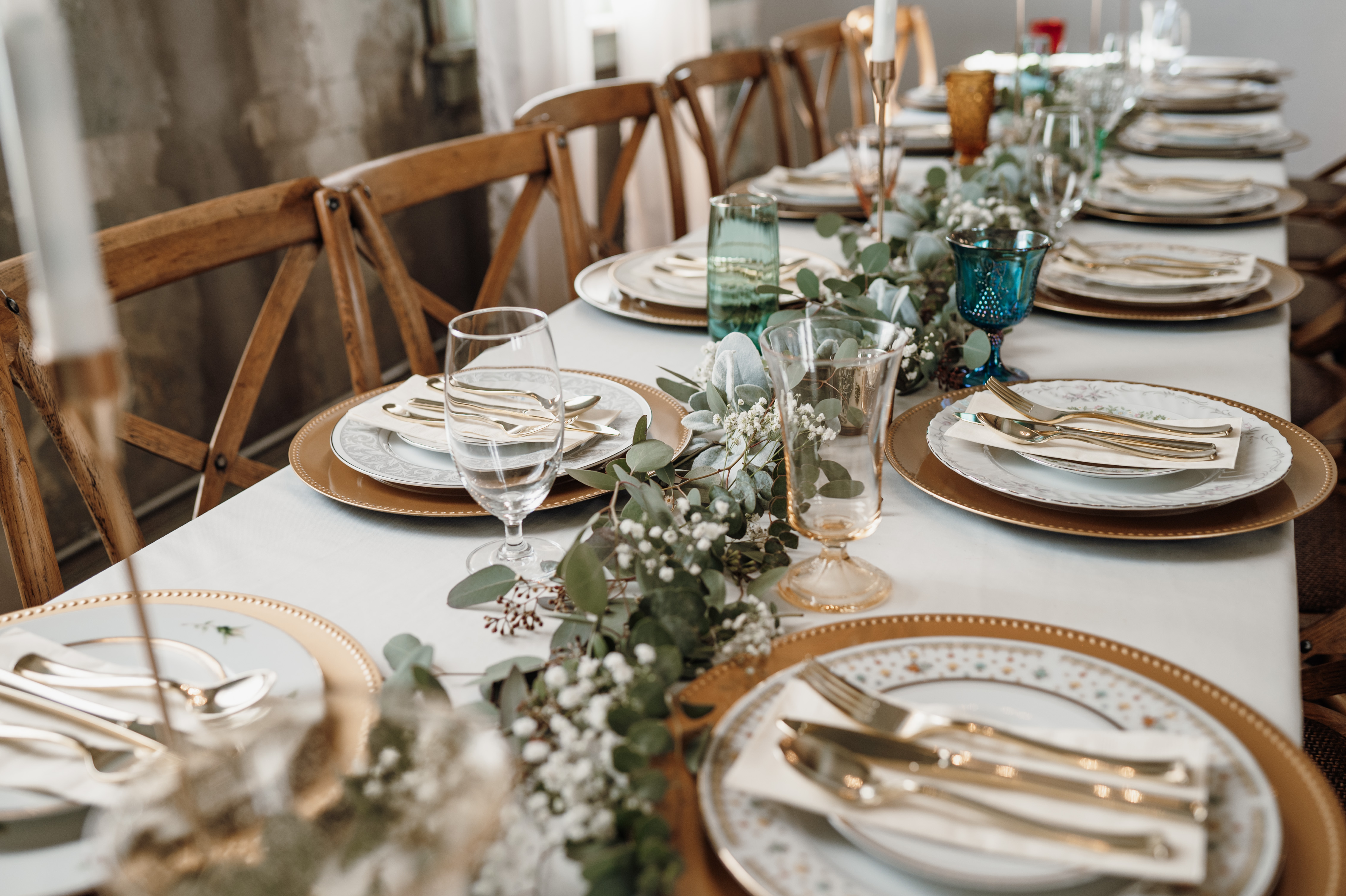 simple gold and white place settings wedding reception
